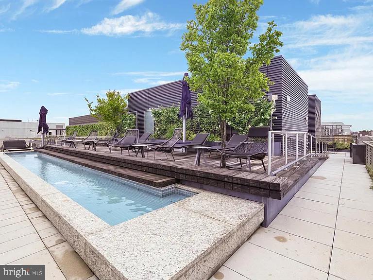920 I Street Northwest, Unit 704 Washington, DC 20001 - Photo 23 of 24 a swimming pool with outdoor seating and yard