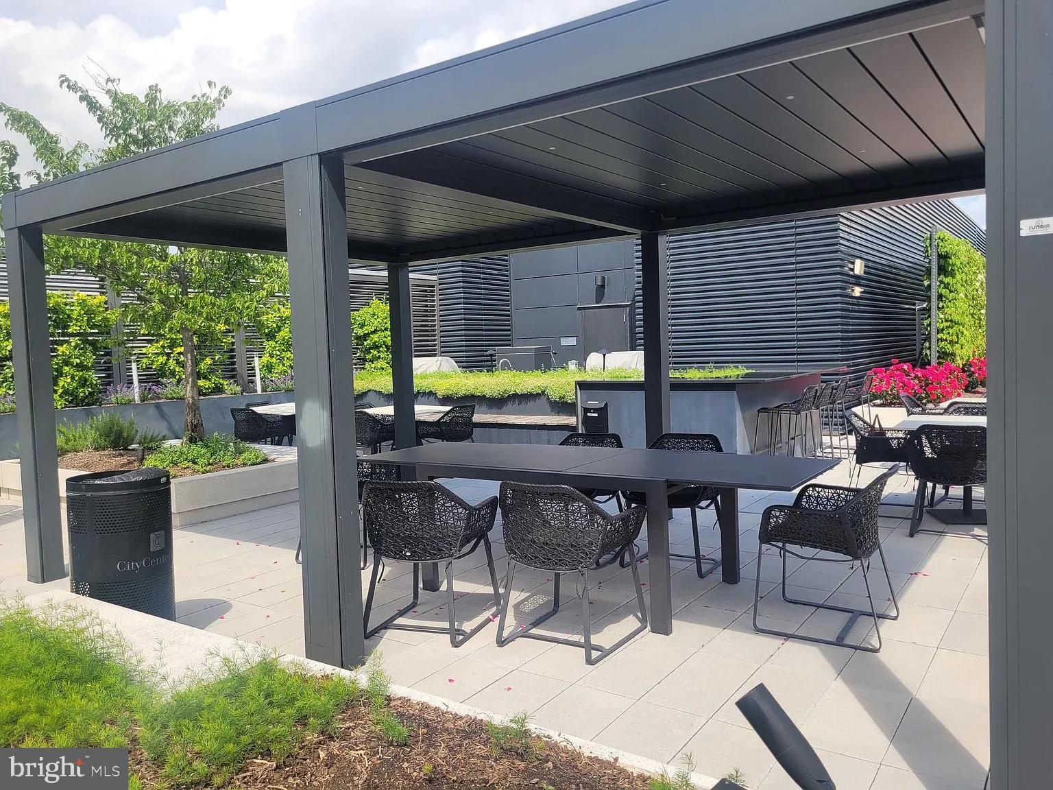 920 I Street Northwest, Unit 704 Washington, DC 20001 - Photo 24 of 24 a view of an outdoor dining space with a patio