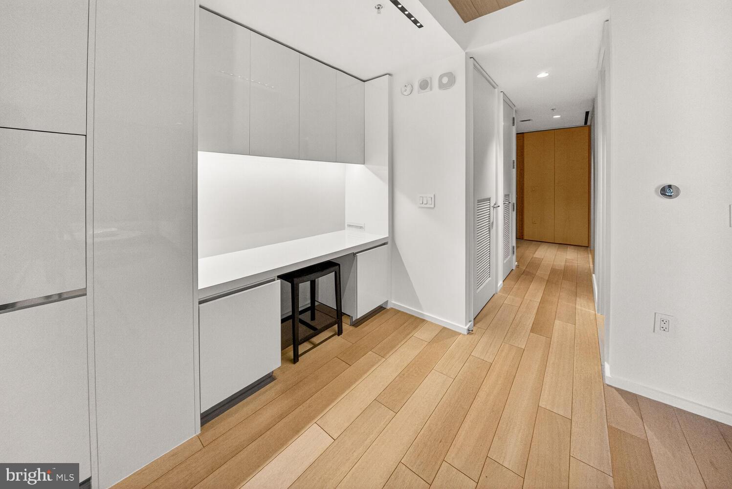 920 I Street Northwest, Unit 704 Washington, DC 20001 - Photo 6 of 24 a view of hallway with stairs and wooden floor