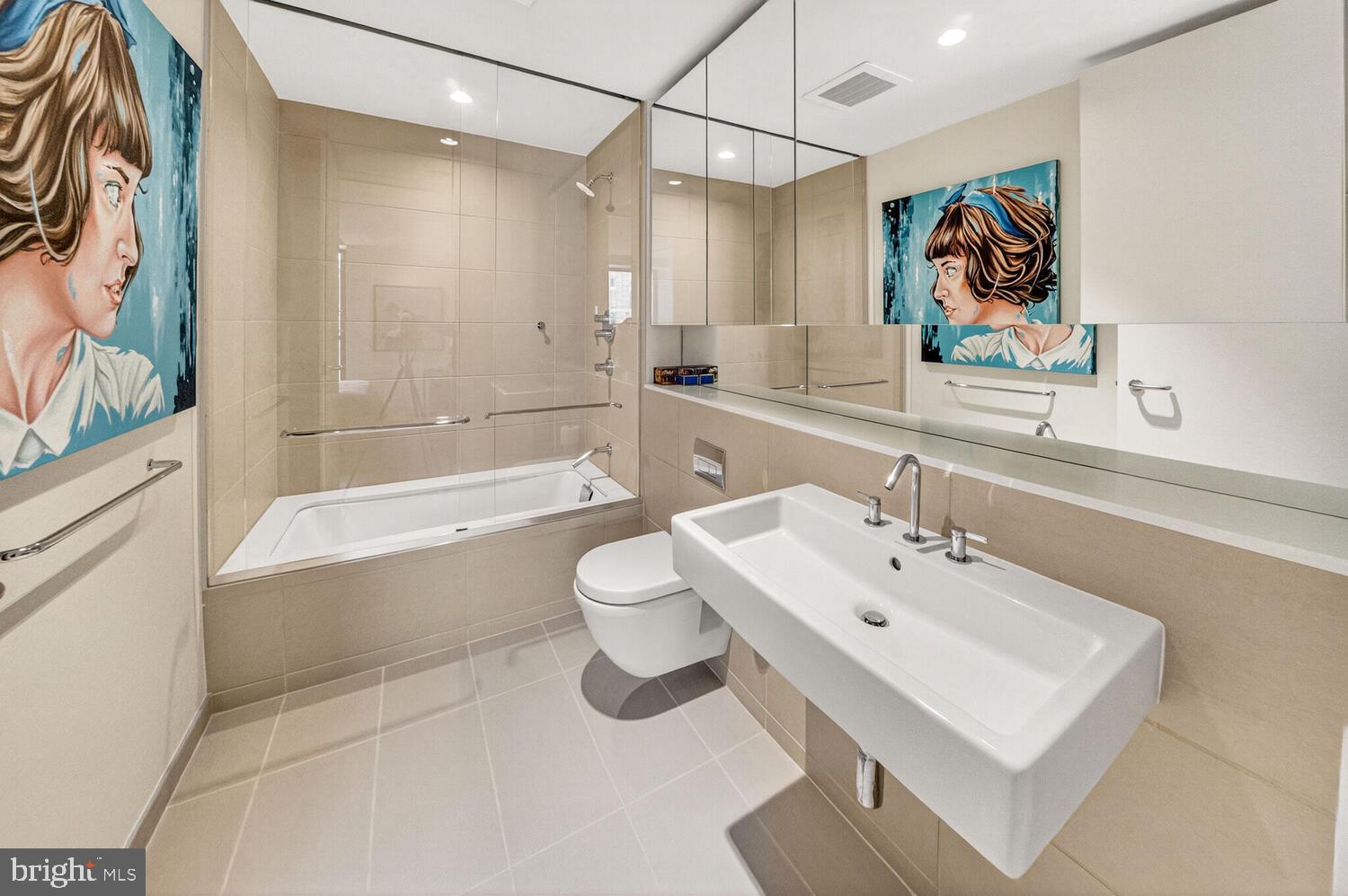 920 I Street Northwest, Unit 704 Washington, DC 20001 - Photo 10 of 24 a bathroom with a sink a toilet and a bathtub