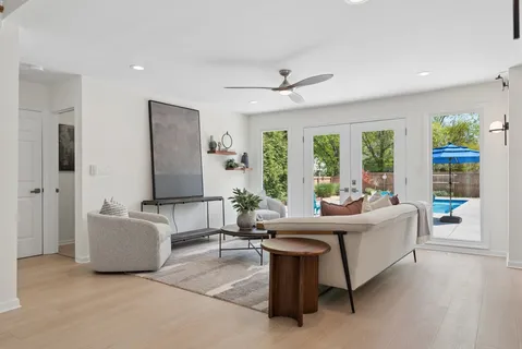 a living room with furniture and a large window