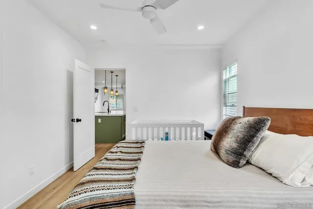 a bedroom with a bed and a window