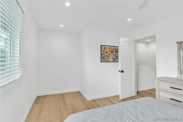 a bedroom with a bed and a cabinets