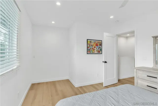 a bedroom with a bed and a cabinets