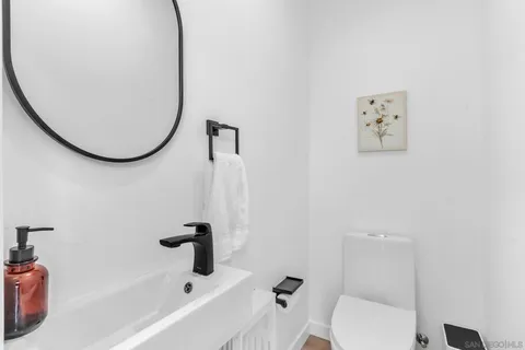 a bathroom with a toilet and a tub