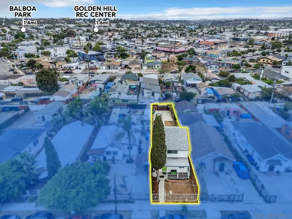 an aerial view of residential houses with outdoor space