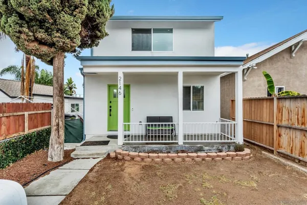 a front view of a house with a porch