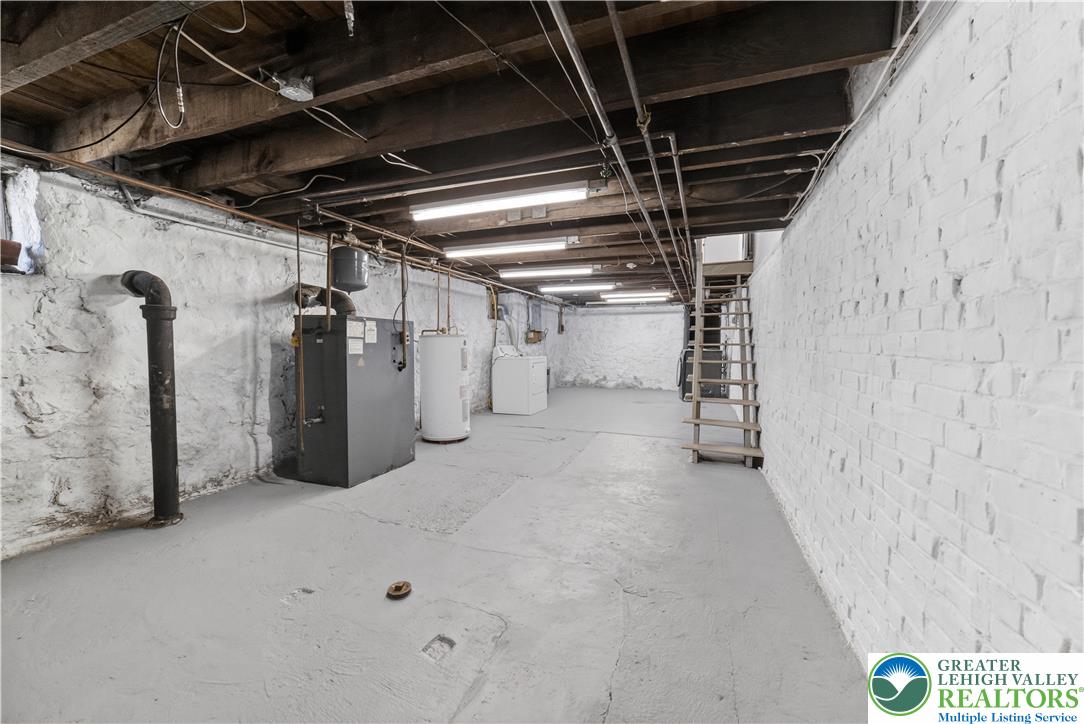 1128 Maple Street Bethlehem, PA 18018 - Photo 22 of 34 A utilitarian basement provides ample storage and houses essential home systems.