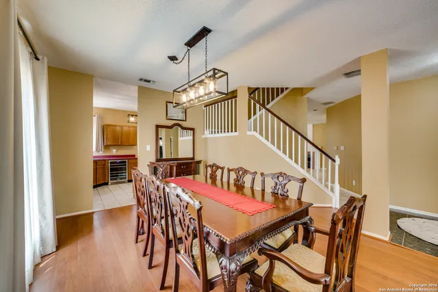 a view of a dining room with furniture and wooden floor
