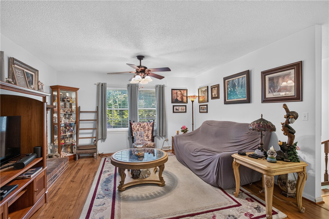 104 Laurel Lane Seneca, SC 29678 - Photo 6 of 36 Wood flooring and natural light create a welcoming and comfortable living space.