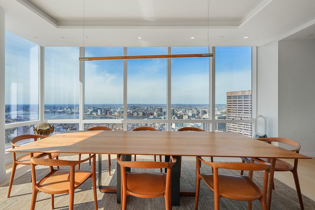 1 Franklin Street, Unit 4802 Boston, MA 02110 - Photo 7 of 42 a dining room with furniture and wooden floor