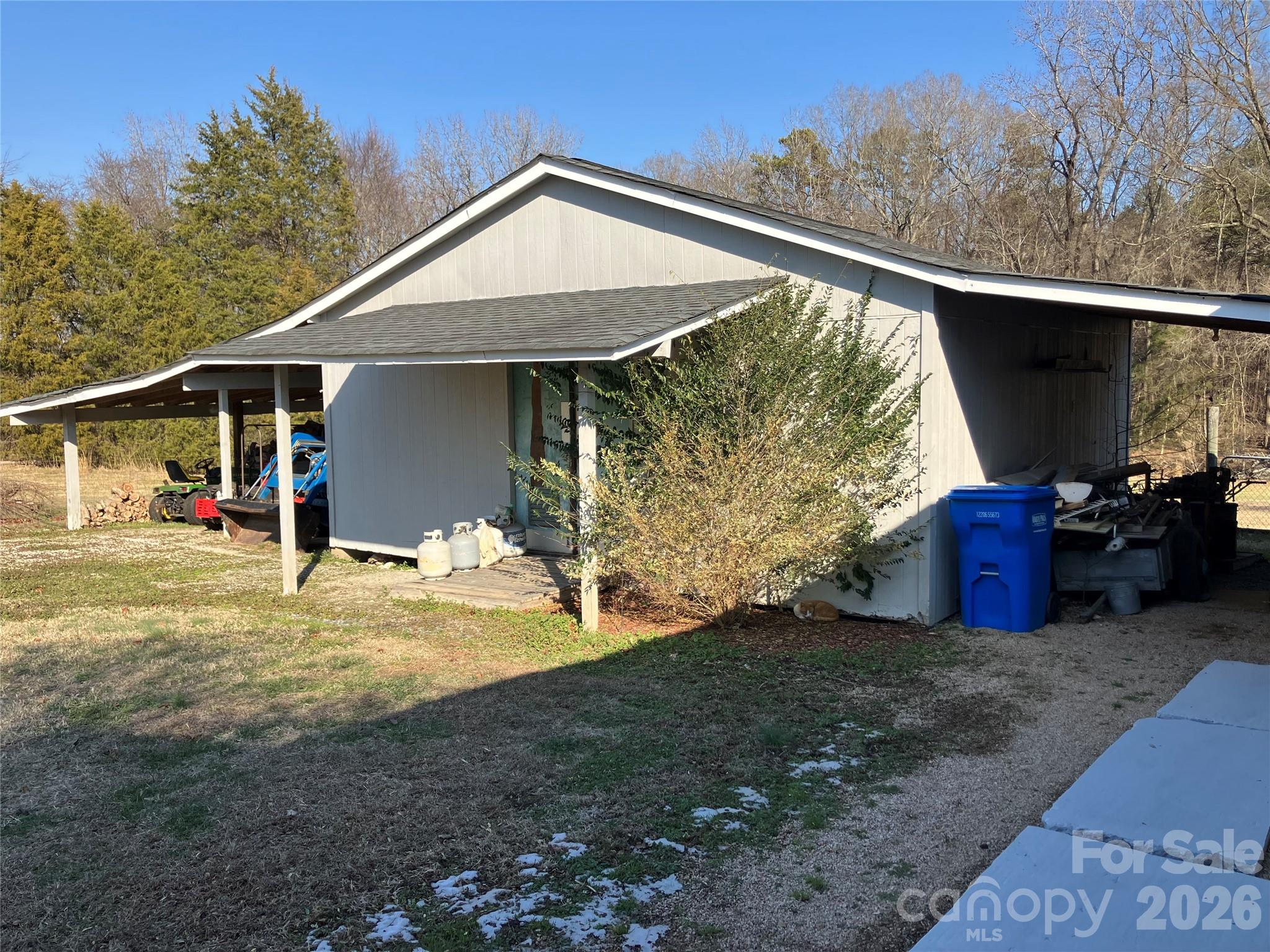 13215 Pine Bluff Road Midland, NC 28107 - Photo 18 of 48 a front view of a house with garden