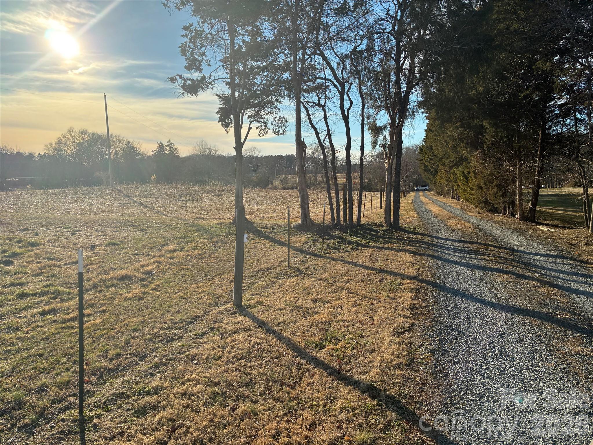 13215 Pine Bluff Road Midland, NC 28107 - Photo 2 of 48 a view of a yard with wooden fence