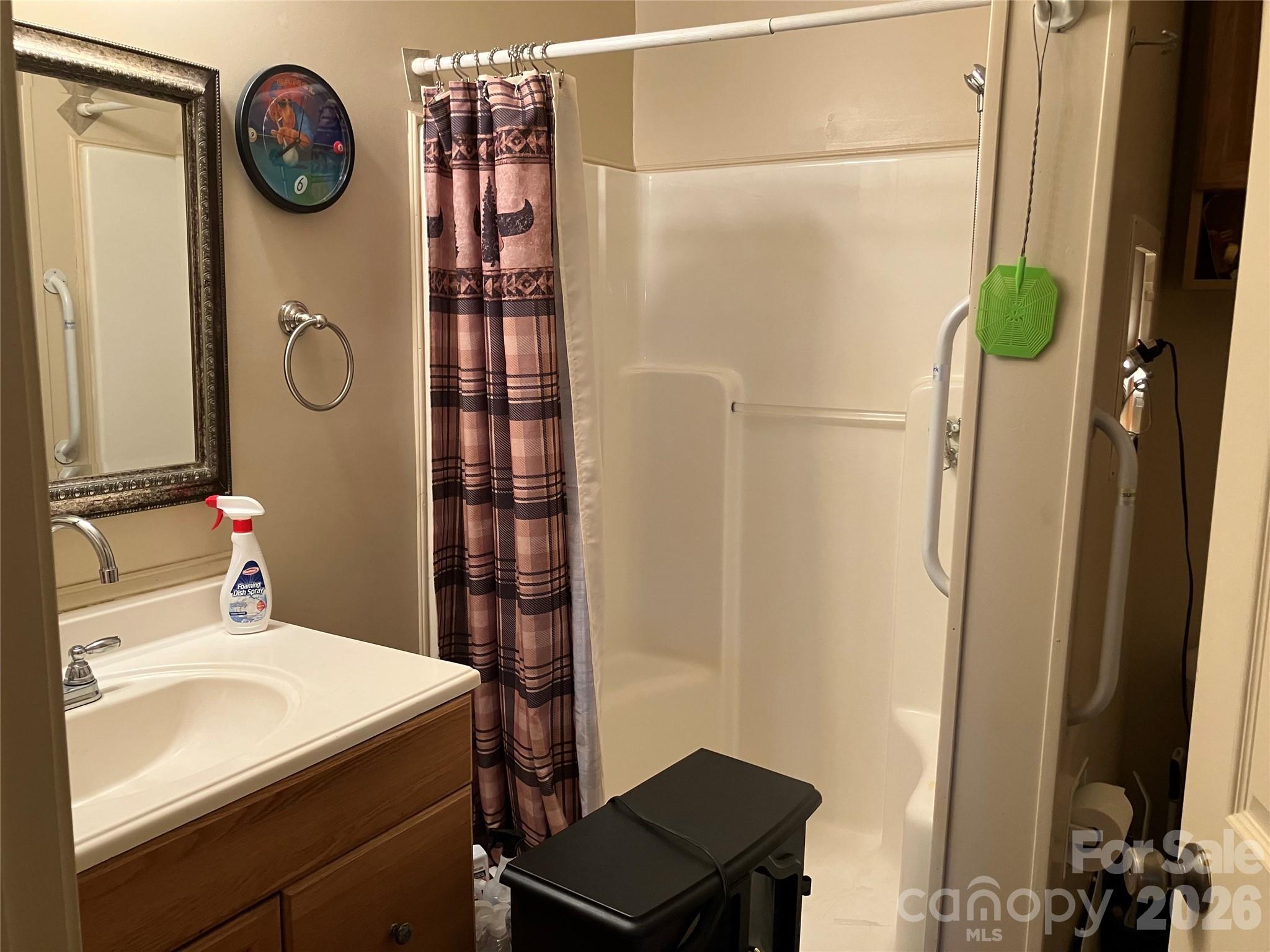 13215 Pine Bluff Road Midland, NC 28107 - Photo 21 of 48 a bathroom with a sink toilet and shower