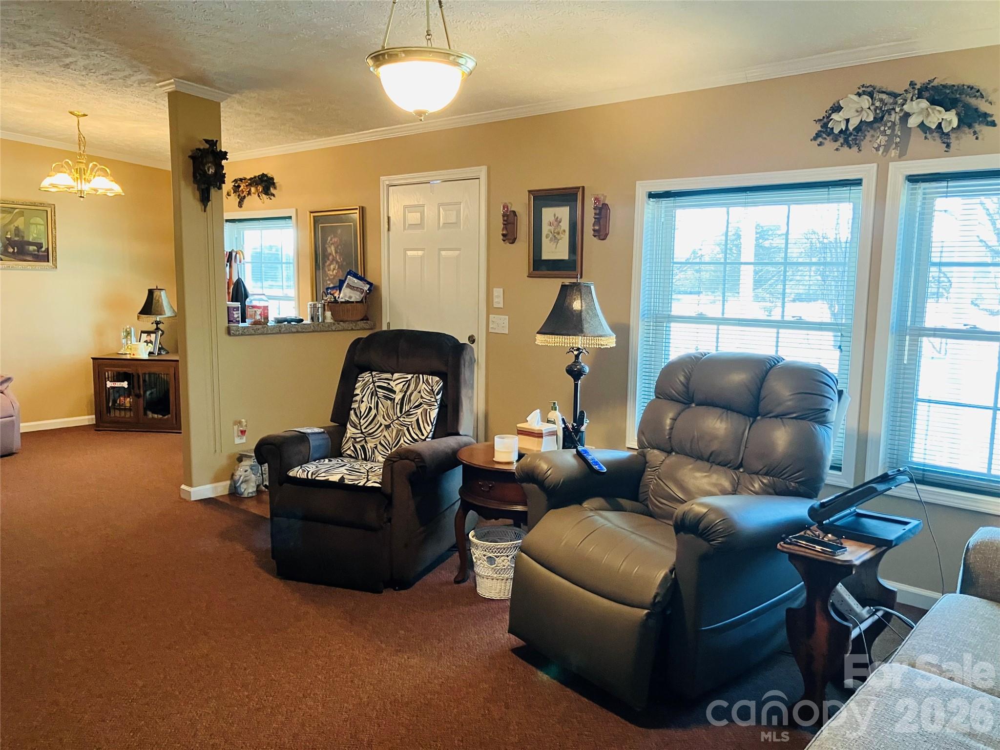 13215 Pine Bluff Road Midland, NC 28107 - Photo 24 of 46 a living room with furniture and a large window