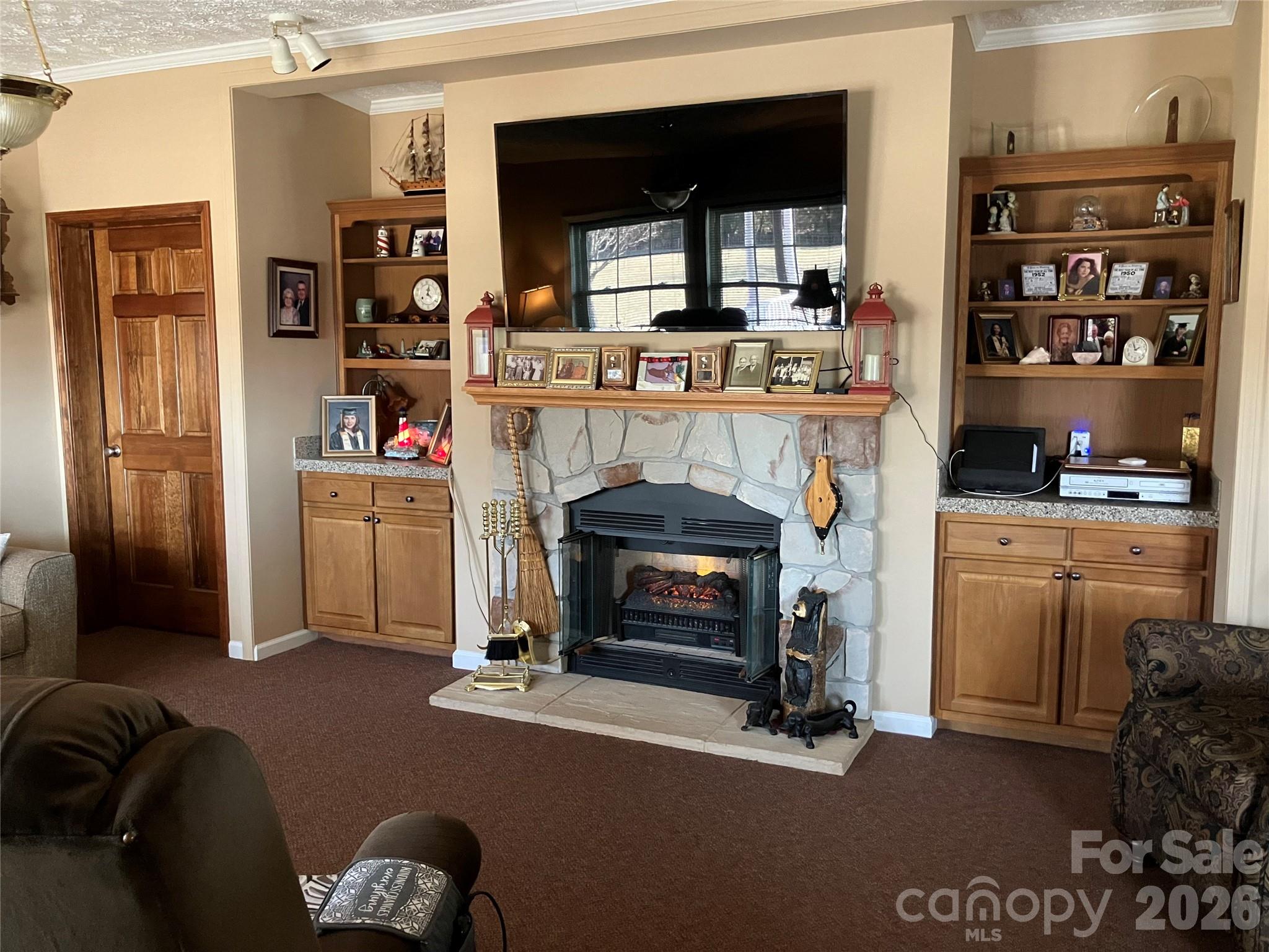 13215 Pine Bluff Road Midland, NC 28107 - Photo 25 of 46 a living room with furniture and a fireplace