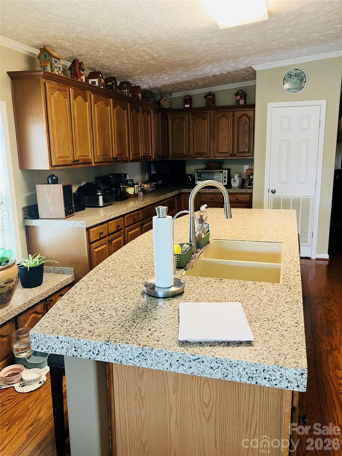 13215 Pine Bluff Road Midland, NC 28107 - Photo 28 of 46 a kitchen with granite countertop a sink a stove and a wooden cabinets