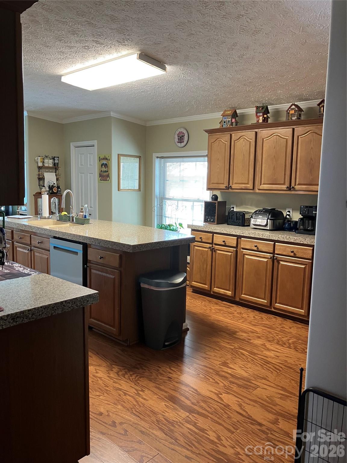 13215 Pine Bluff Road Midland, NC 28107 - Photo 29 of 48 a kitchen with stainless steel appliances granite countertop a sink counter space and cabinets