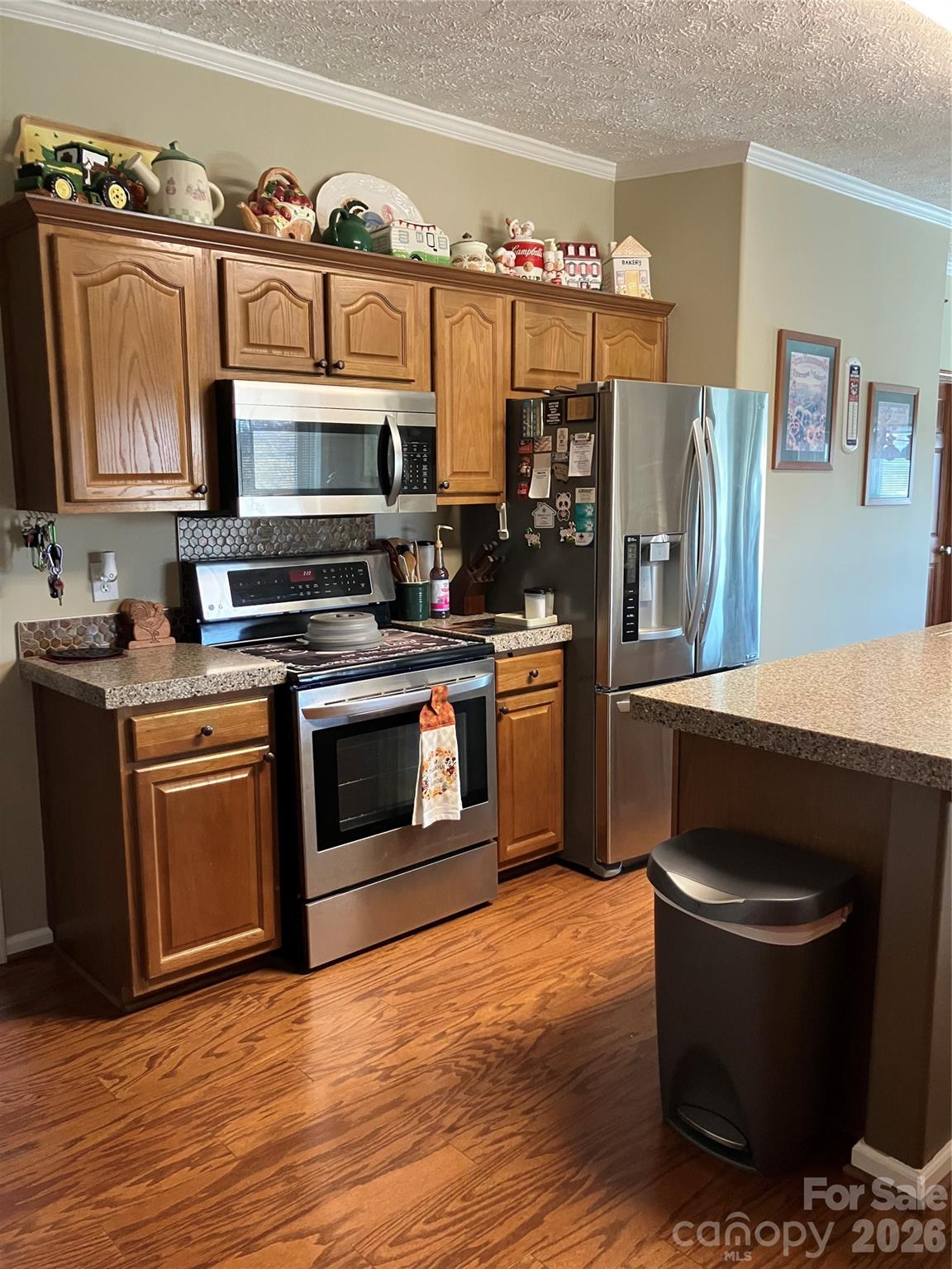 13215 Pine Bluff Road Midland, NC 28107 - Photo 30 of 48 a kitchen with stainless steel appliances a stove a refrigerator and a stove
