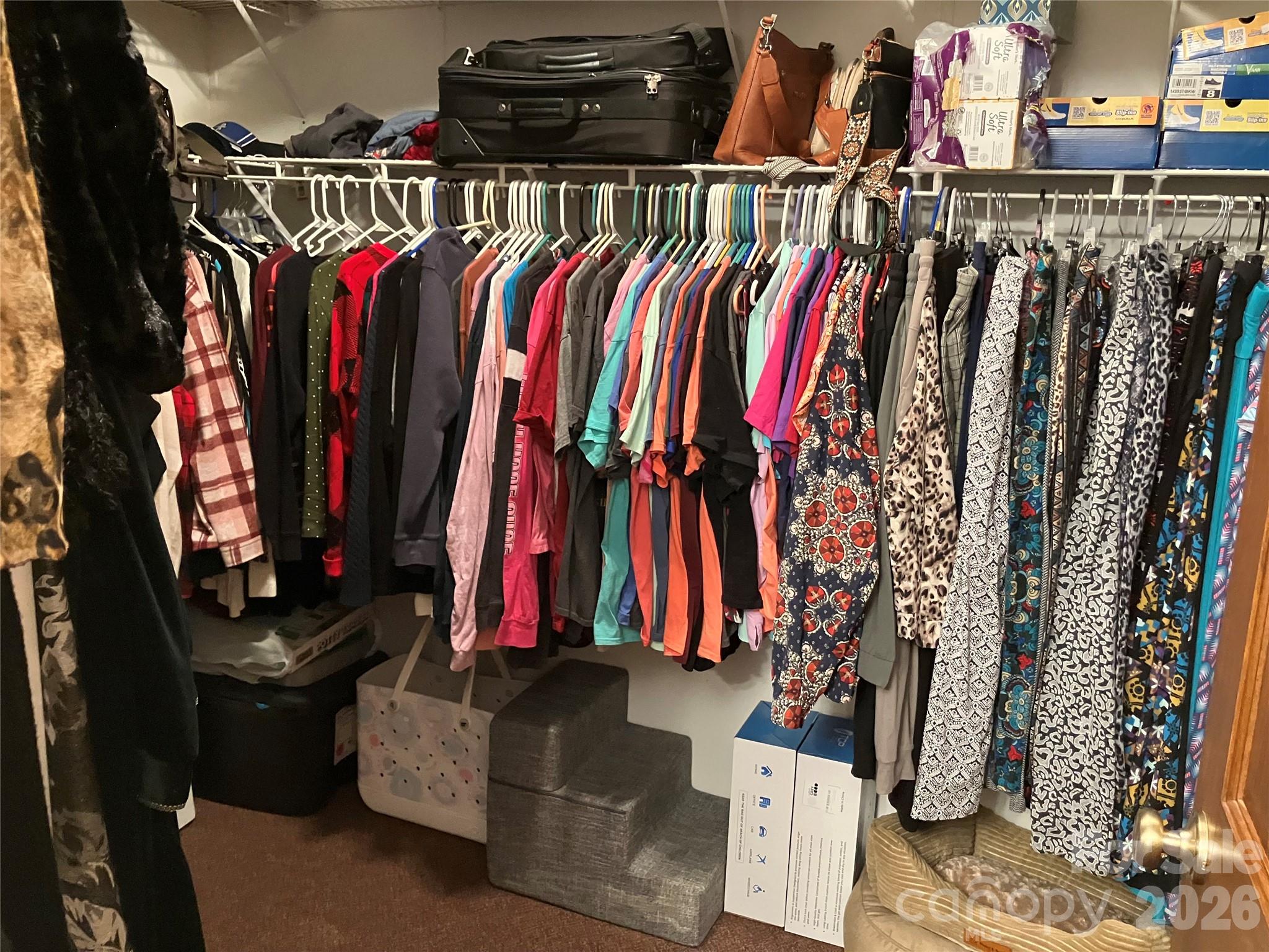 13215 Pine Bluff Road Midland, NC 28107 - Photo 36 of 48 a view of walk in closet with clothes