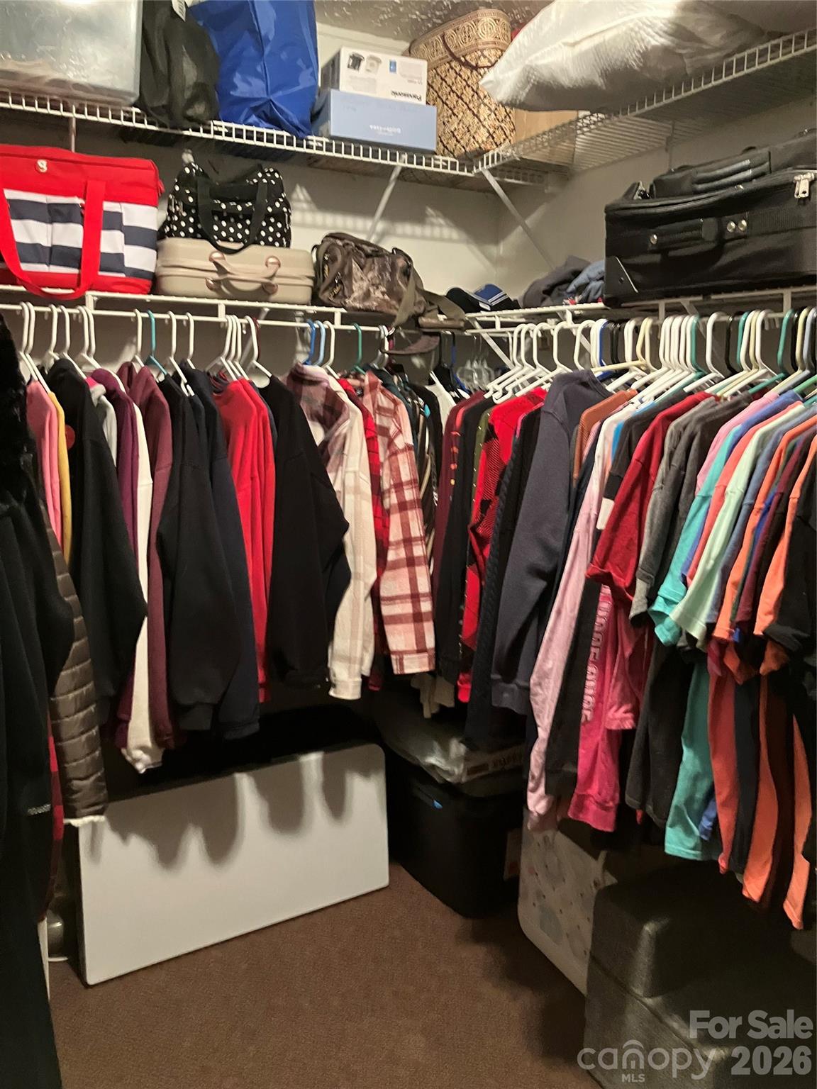 13215 Pine Bluff Road Midland, NC 28107 - Photo 37 of 48 a view of walk in closet with clothes and shoes