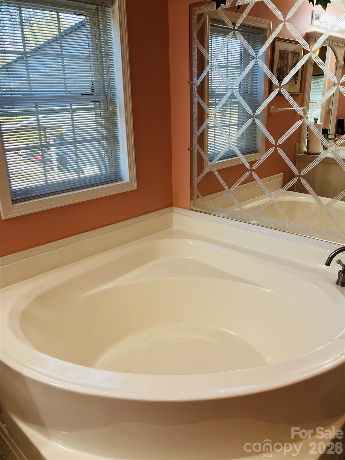 13215 Pine Bluff Road Midland, NC 28107 - Photo 39 of 46 a white bath tub sitting next to a window
