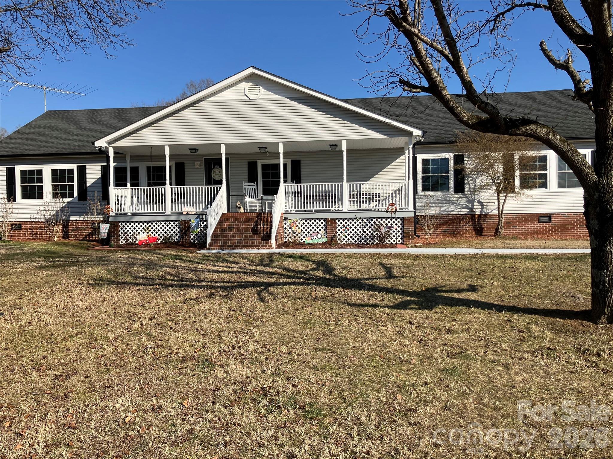 13215 Pine Bluff Road Midland, NC 28107 - Photo 4 of 48 a front view of a house with a yard outdoor seating and barbeque oven
