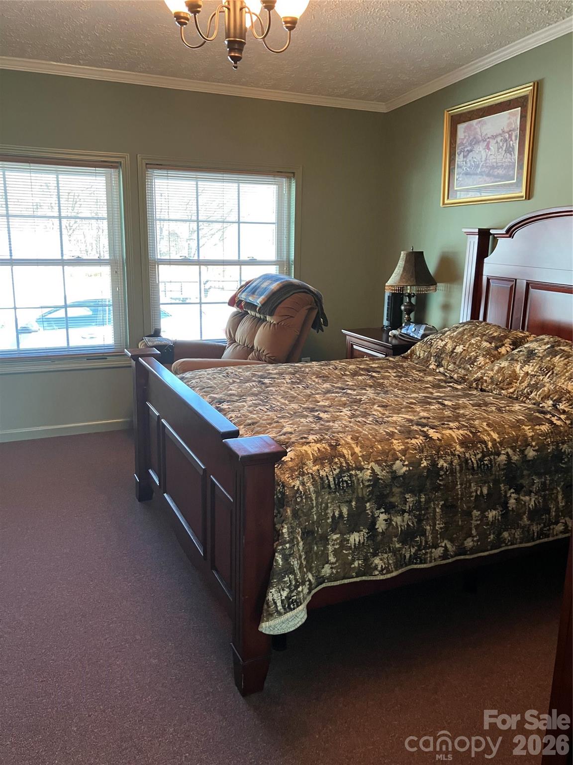 13215 Pine Bluff Road Midland, NC 28107 - Photo 45 of 48 a bed sitting in a bedroom next to a window