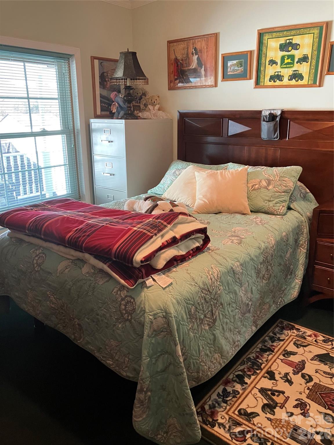 13215 Pine Bluff Road Midland, NC 28107 - Photo 47 of 48 a bed sitting in a bedroom next to a window
