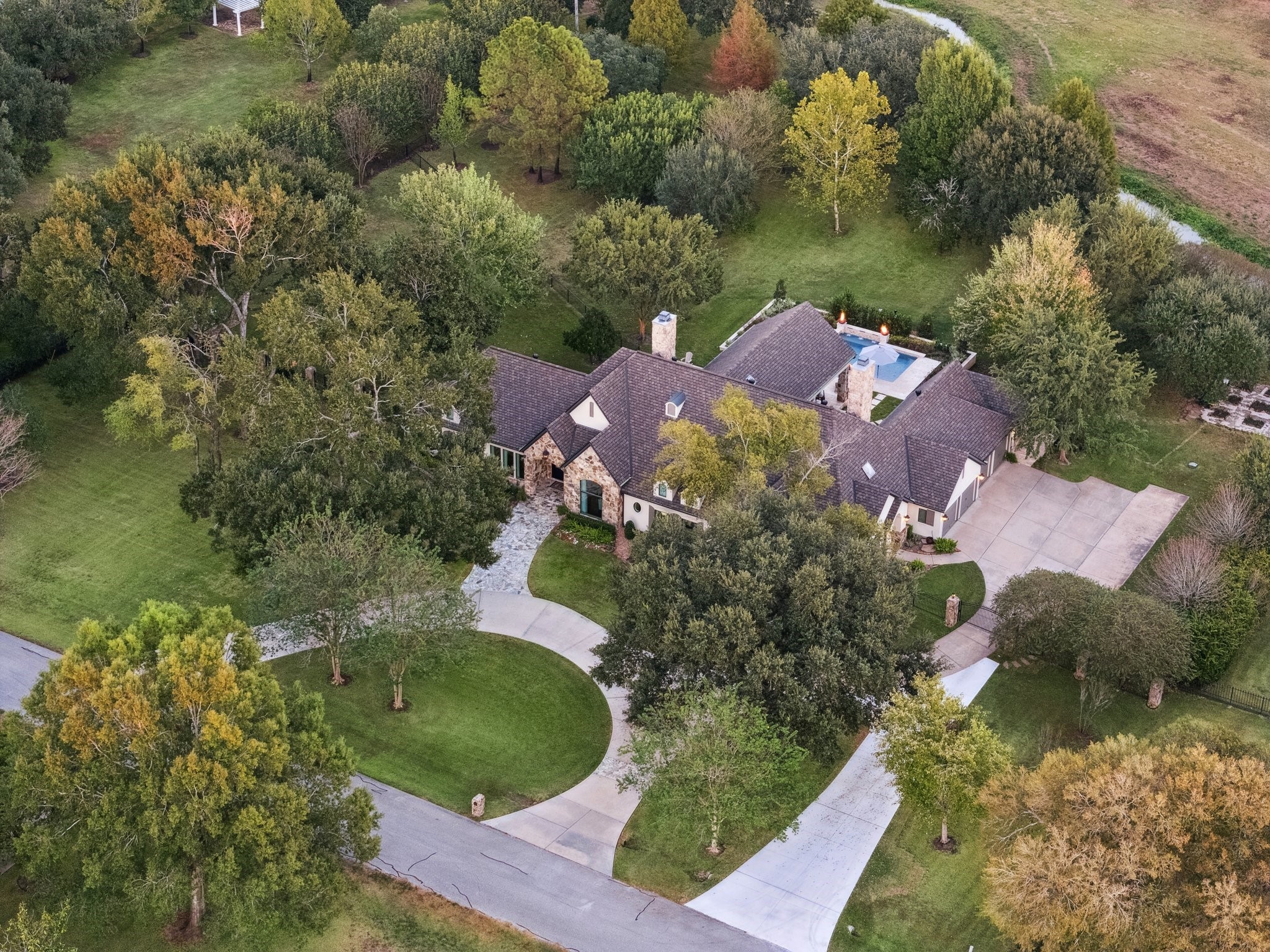 6602 Riva Ridge Drive Richmond, TX 77406 - Photo 26 of 50 an aerial view of a house with a yard and lake view