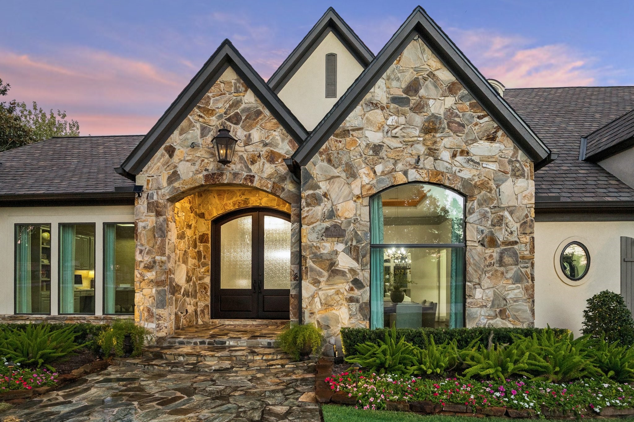 6602 Riva Ridge Drive Richmond, TX 77406 - Photo 32 of 50 front view of a brick house with potted plants