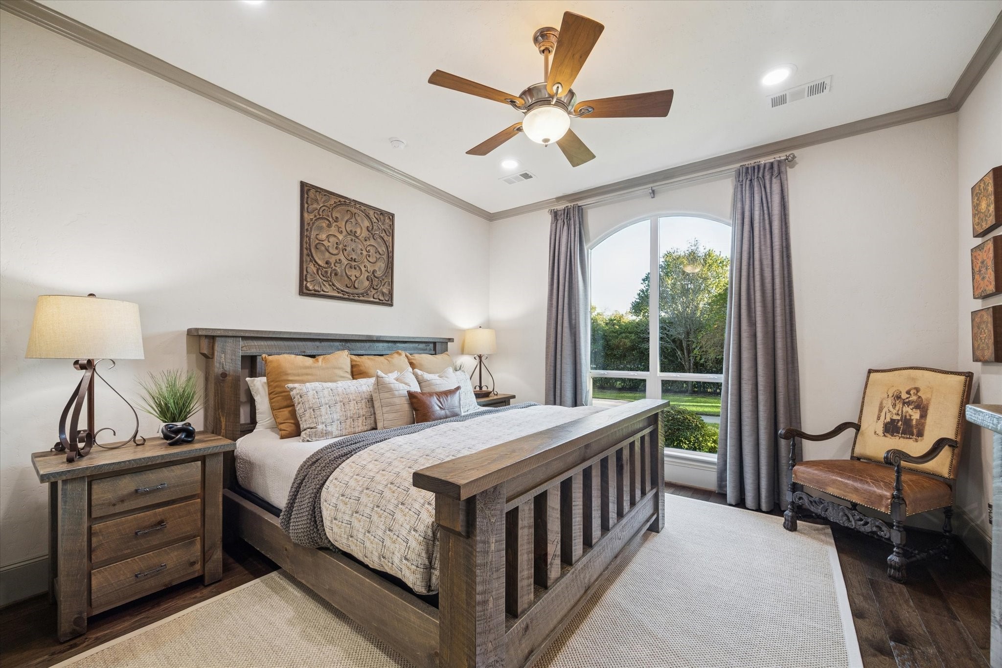 6602 Riva Ridge Drive Richmond, TX 77406 - Photo 39 of 50 a bedroom with a bed a chandelier and a window