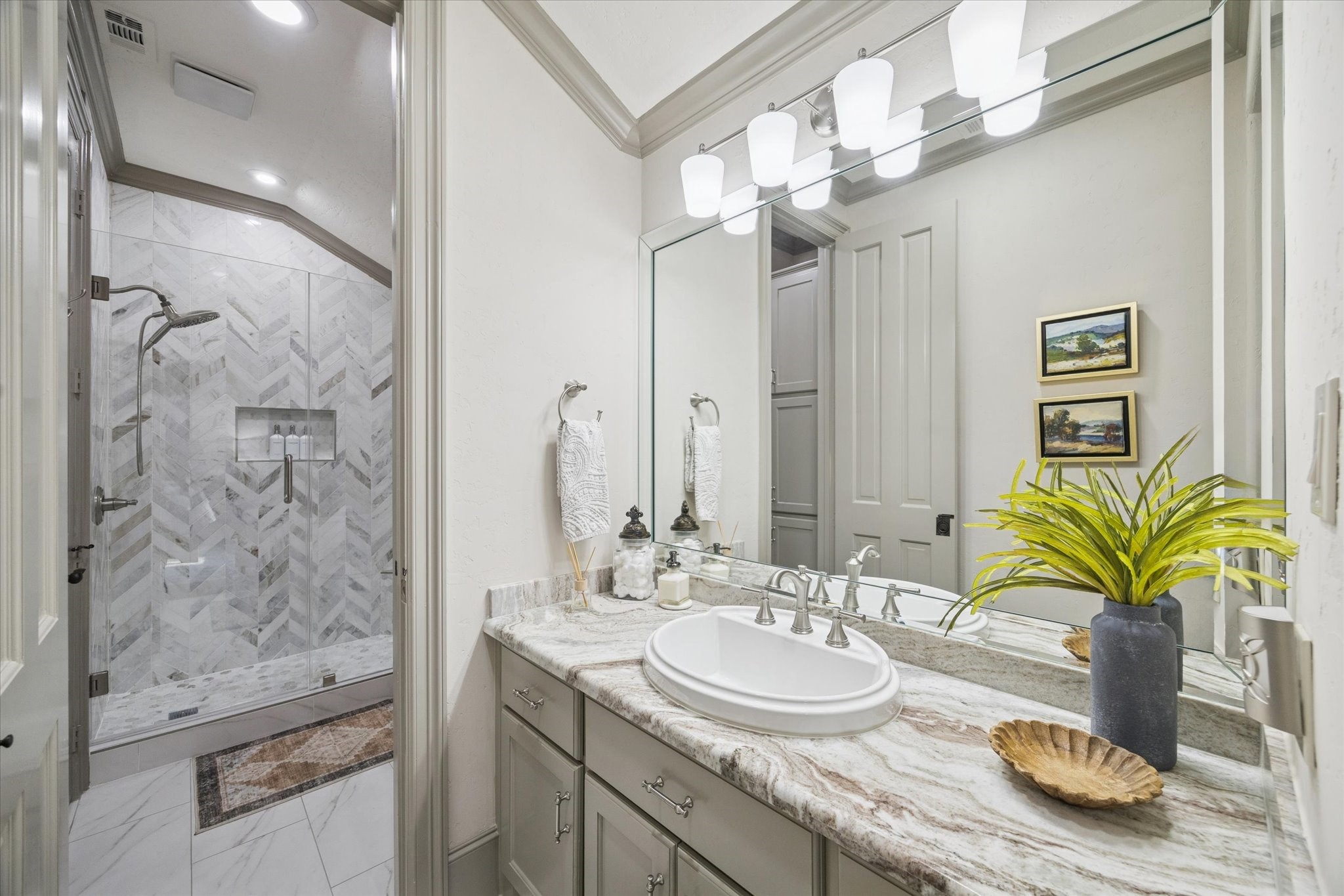 6602 Riva Ridge Drive Richmond, TX 77406 - Photo 40 of 50 a bathroom with a granite countertop sink a potted plant and a mirror