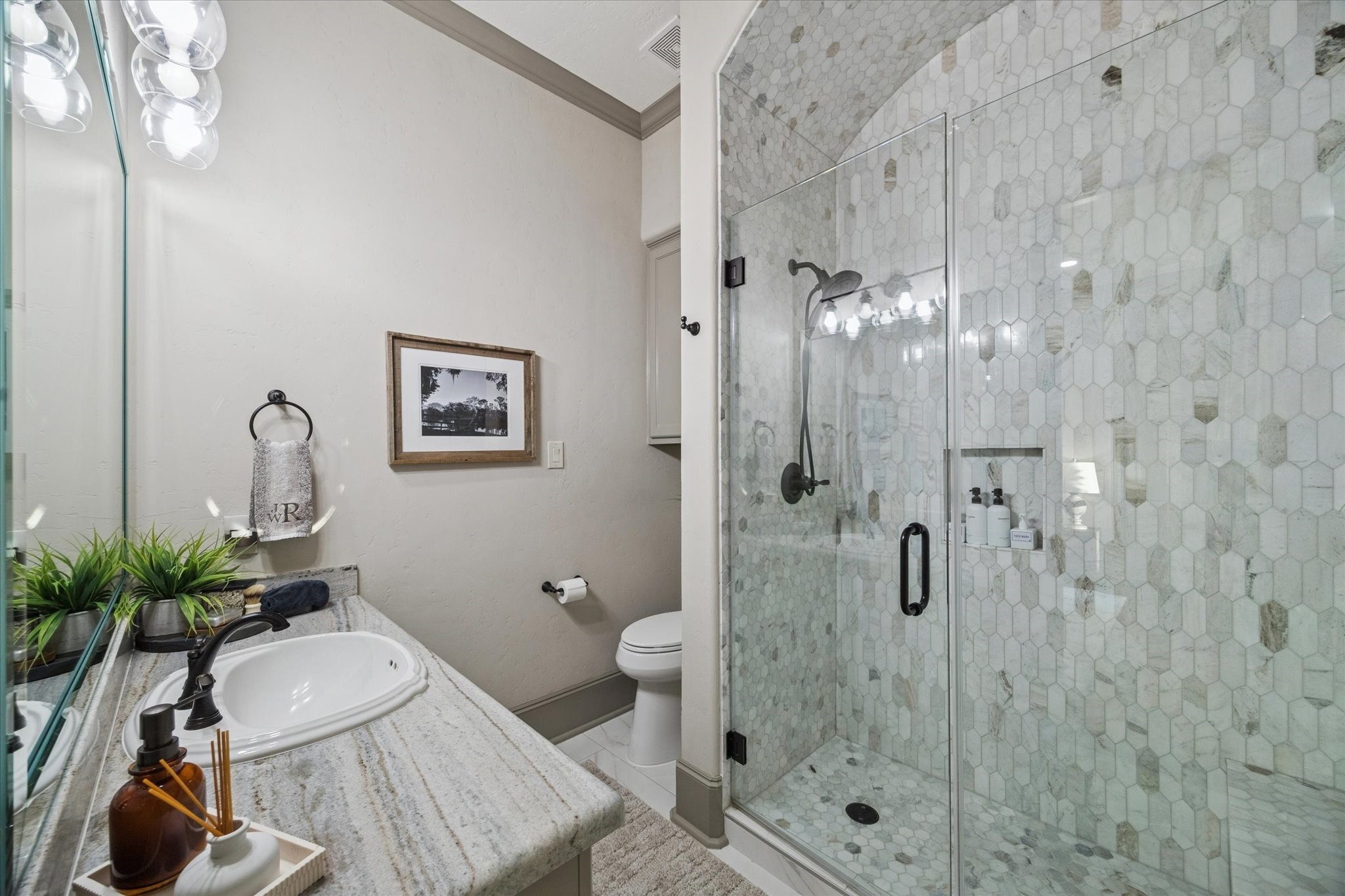 6602 Riva Ridge Drive Richmond, TX 77406 - Photo 44 of 50 a bathroom with a granite countertop sink a toilet and shower