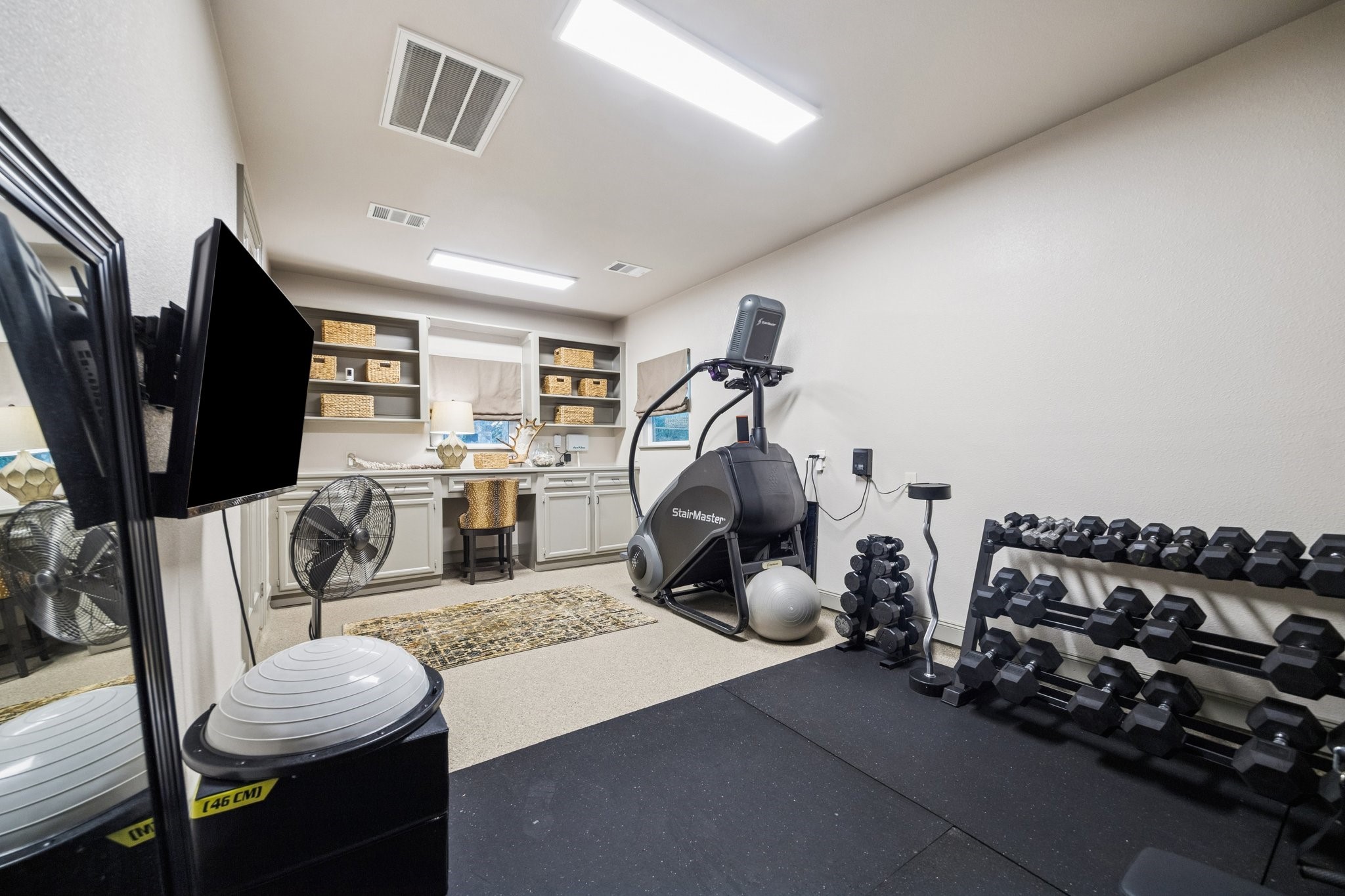 6602 Riva Ridge Drive Richmond, TX 77406 - Photo 47 of 50 a work room with furniture and a flat screen tv