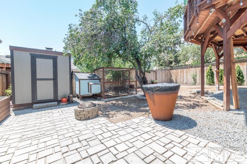 805 Reeves Avenue Reno, NV 89503 - Photo 13 of 21 a view of a patio with table and chairs and wooden fence