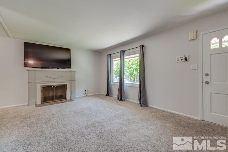 805 Reeves Avenue Reno, NV 89503 - Photo 4 of 21 a living room with a fireplace and a flat screen tv