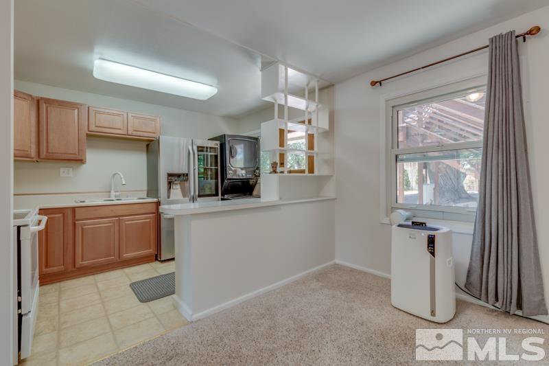 805 Reeves Avenue Reno, NV 89503 - Photo 7 of 21 a kitchen with a sink stove and cabinets