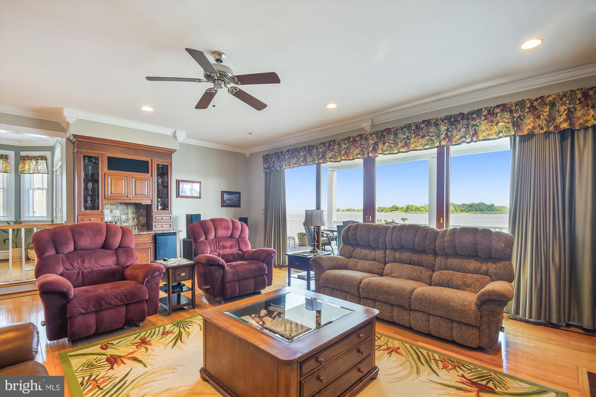 9109 Cuckold Point Road Baltimore, MD 21219 - Photo 22 of 37 a living room with furniture and a large window
