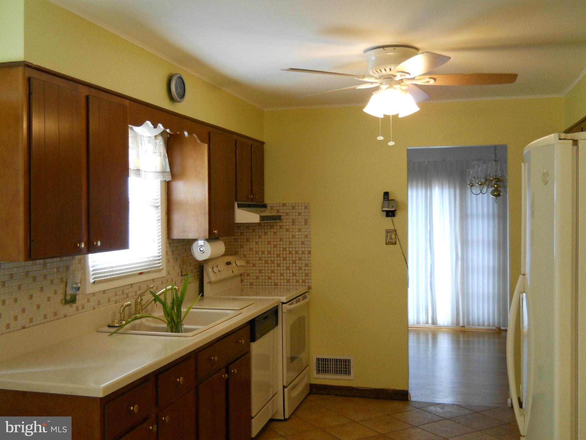 3604 Bellmore Road Baltimore, MD 21244 - Photo 2 of 19 a bathroom with a sink and a mirror