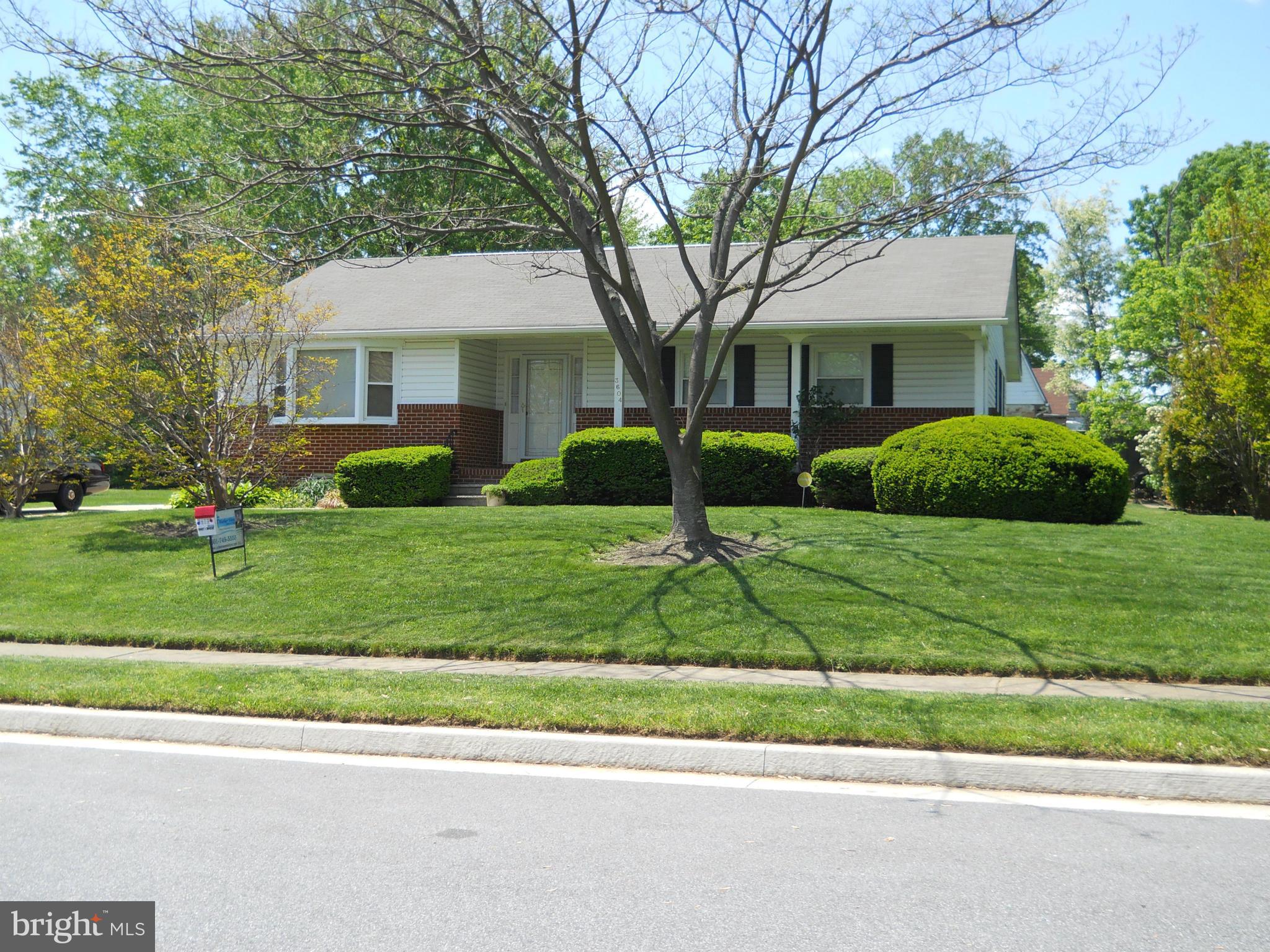 3604 Bellmore Road Baltimore, MD 21244 - Photo 4 of 19 a front view of a house with a yard