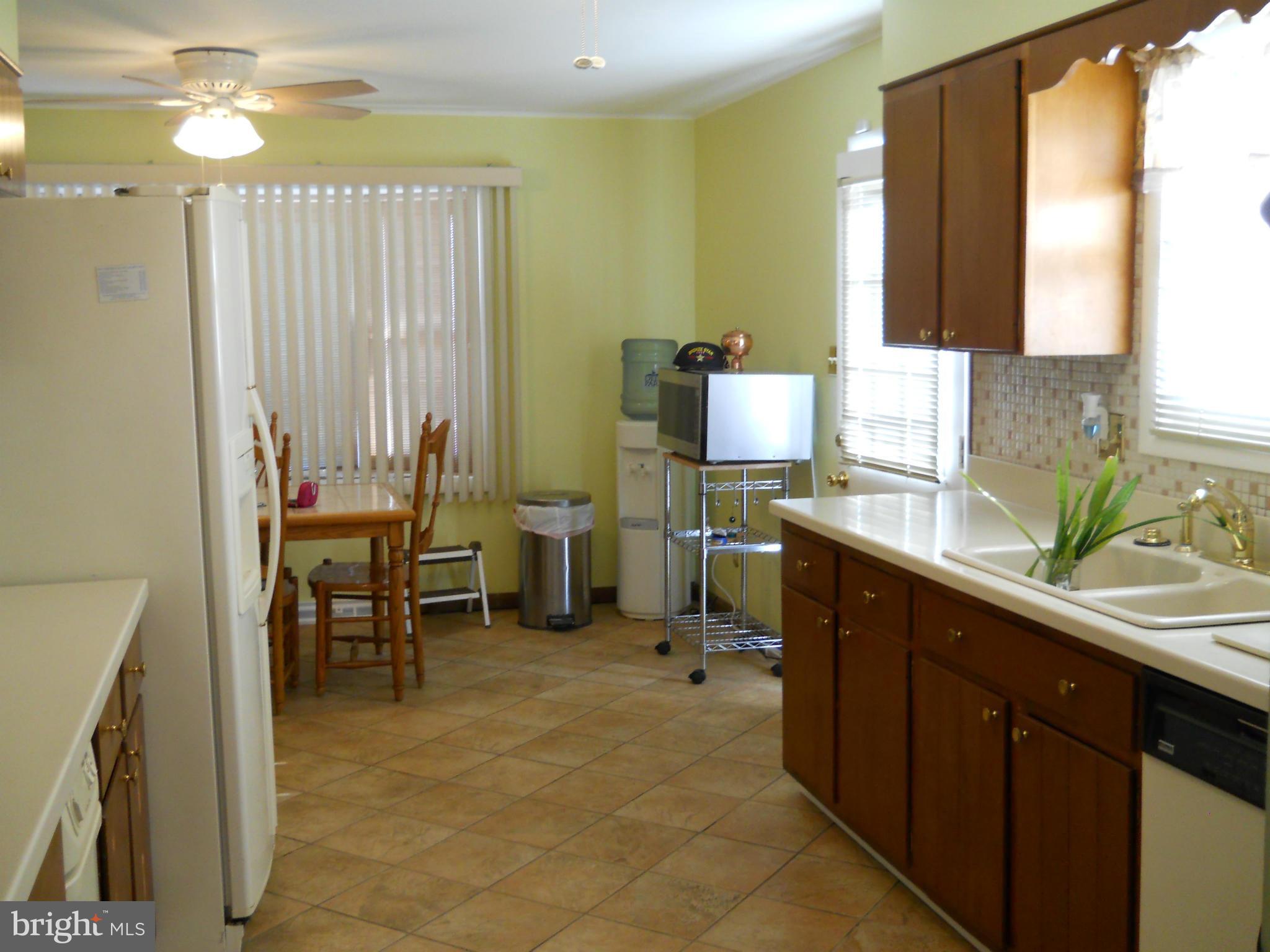 3604 Bellmore Road Baltimore, MD 21244 - Photo 7 of 19 a kitchen with a sink and a window