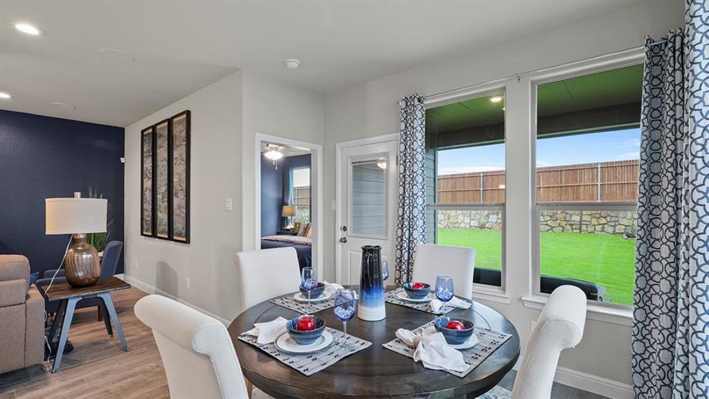 15540 Balham Path Fort Worth, TX 76247 - Photo 9 of 40 a living room with furniture and a flat screen tv