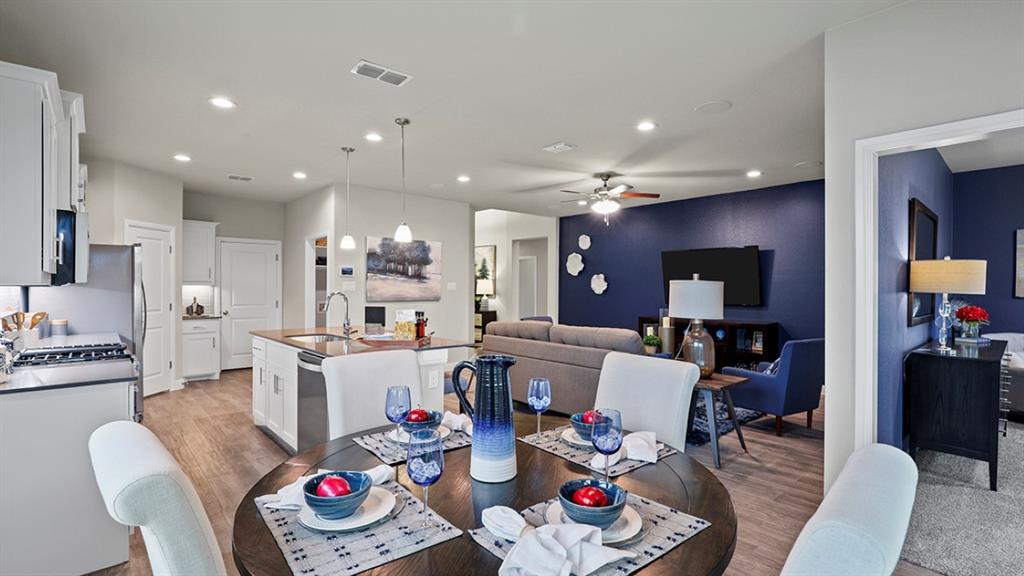 15540 Balham Path Fort Worth, TX 76247 - Photo 10 of 40 a living room with furniture kitchen and a table