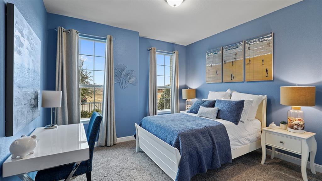 15540 Balham Path Fort Worth, TX 76247 - Photo 18 of 40 a bedroom with a bed and a table