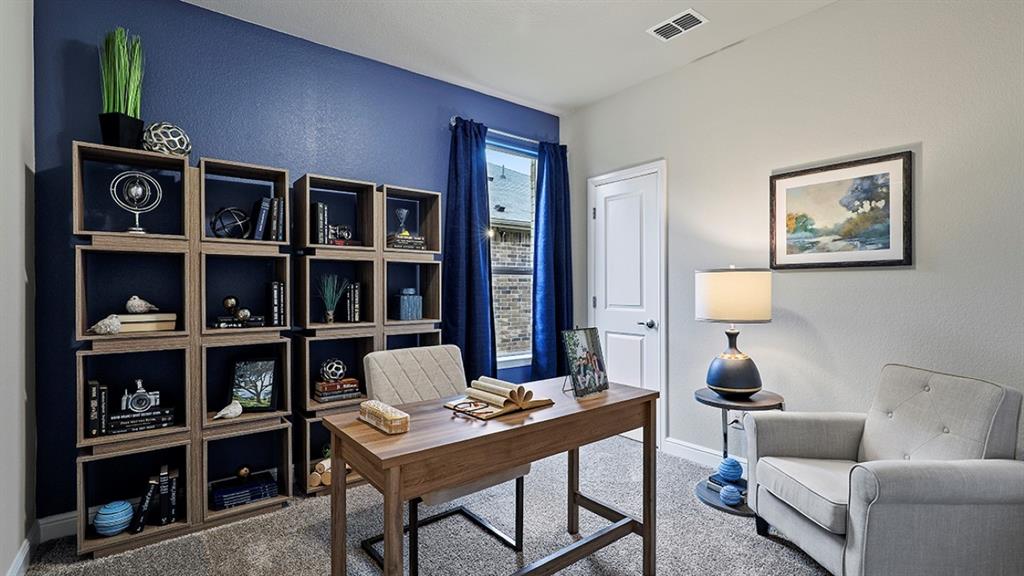 15540 Balham Path Fort Worth, TX 76247 - Photo 21 of 40 a living room with furniture and book shelf
