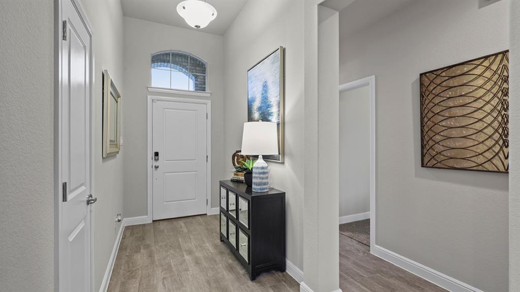 15540 Balham Path Fort Worth, TX 76247 - Photo 26 of 40 a view of an entryway with wooden floor