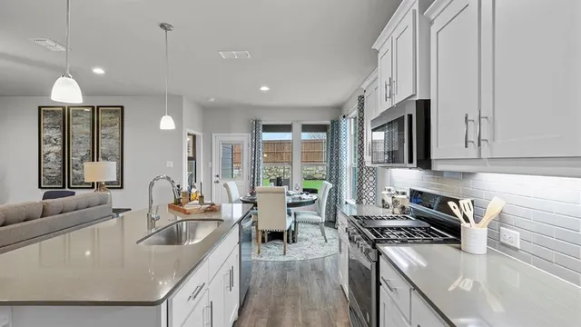 a front view of a house with a garden and yard