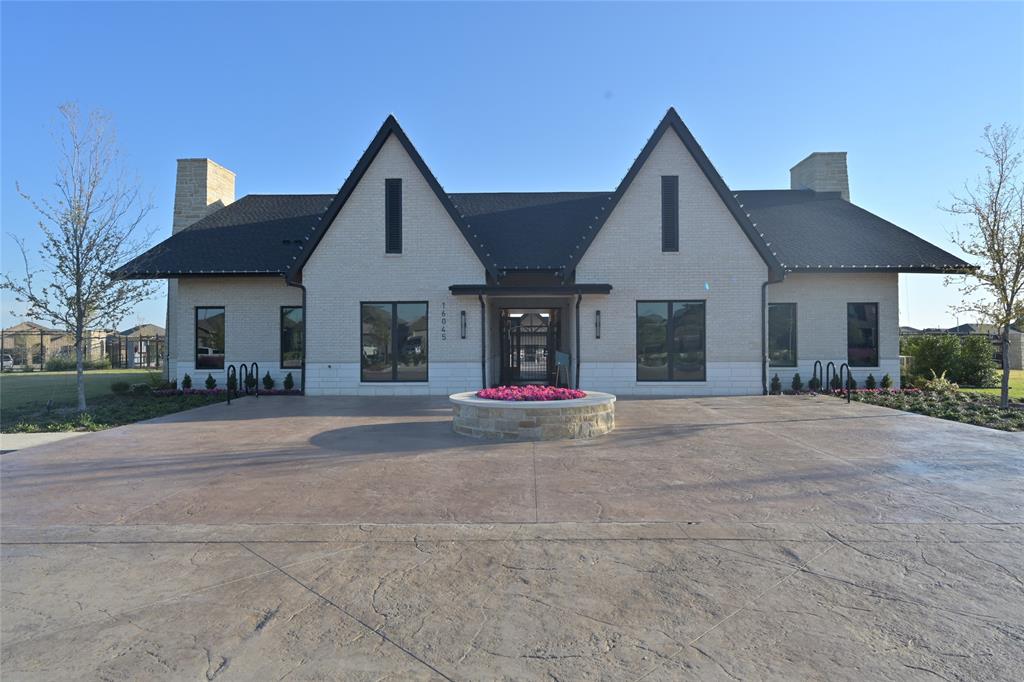 15540 Balham Path Fort Worth, TX 76247 - Photo 32 of 40 a view of a house with a yard and large tree
