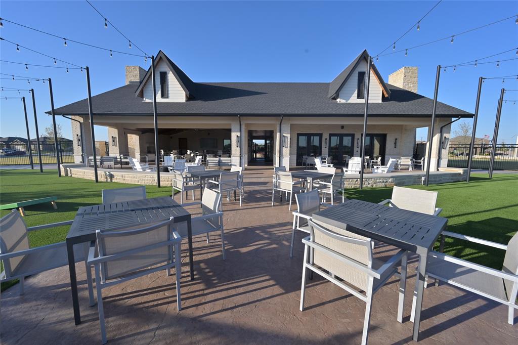 15540 Balham Path Fort Worth, TX 76247 - Photo 33 of 40 a patio with a table and chairs